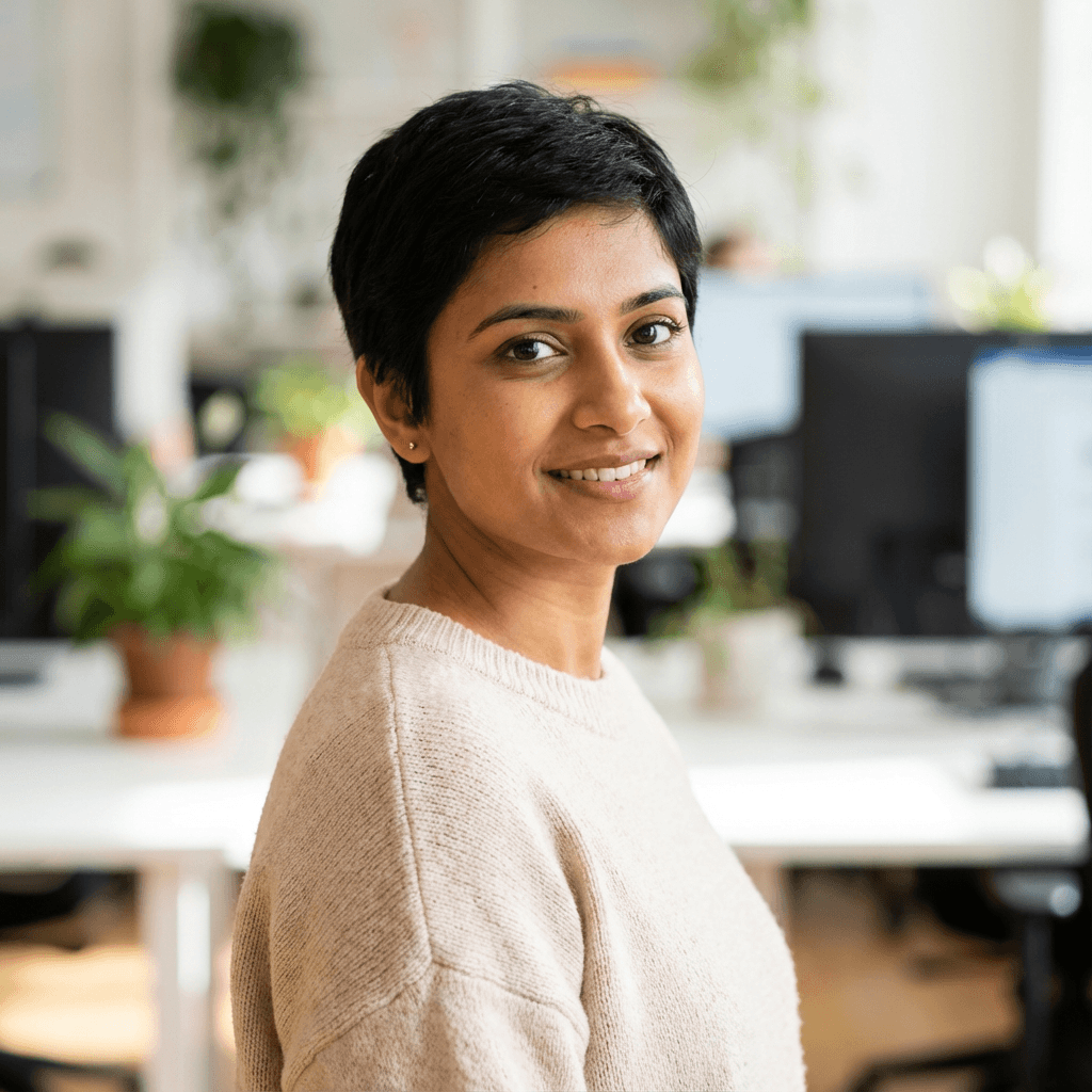 Tine Kris, founder of Kalegacy, in a bright modern workspace